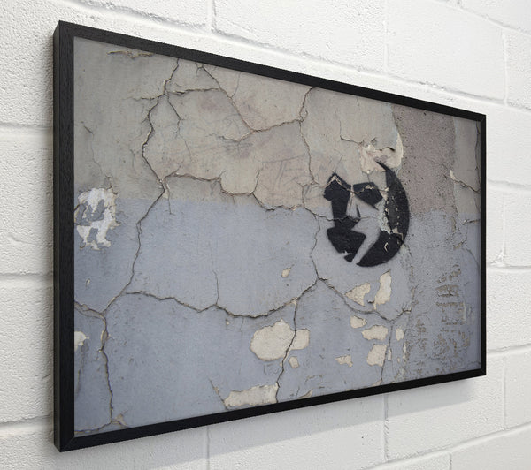 Simple street art on eroded wall