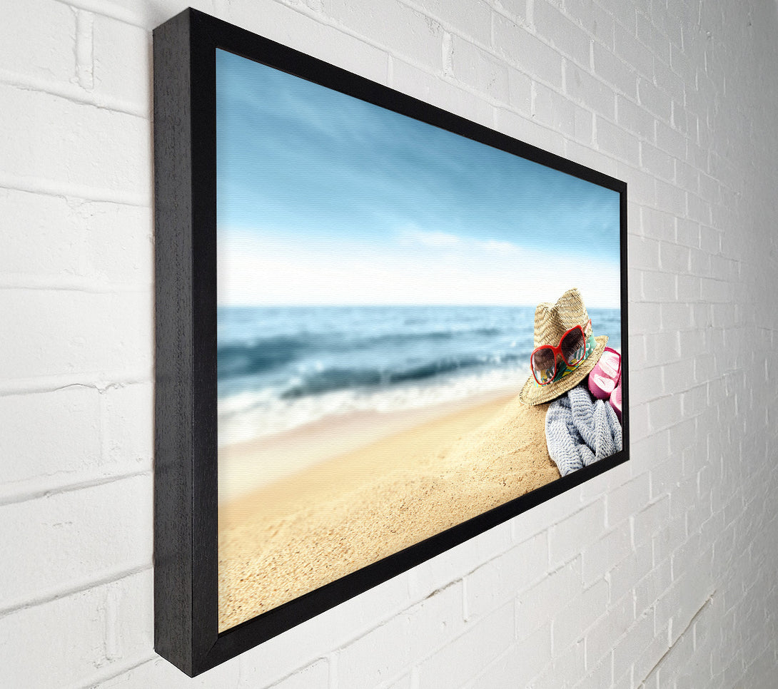  A Canvas Print of Sun hat and sunglasses on the beach Canvas Wall Art