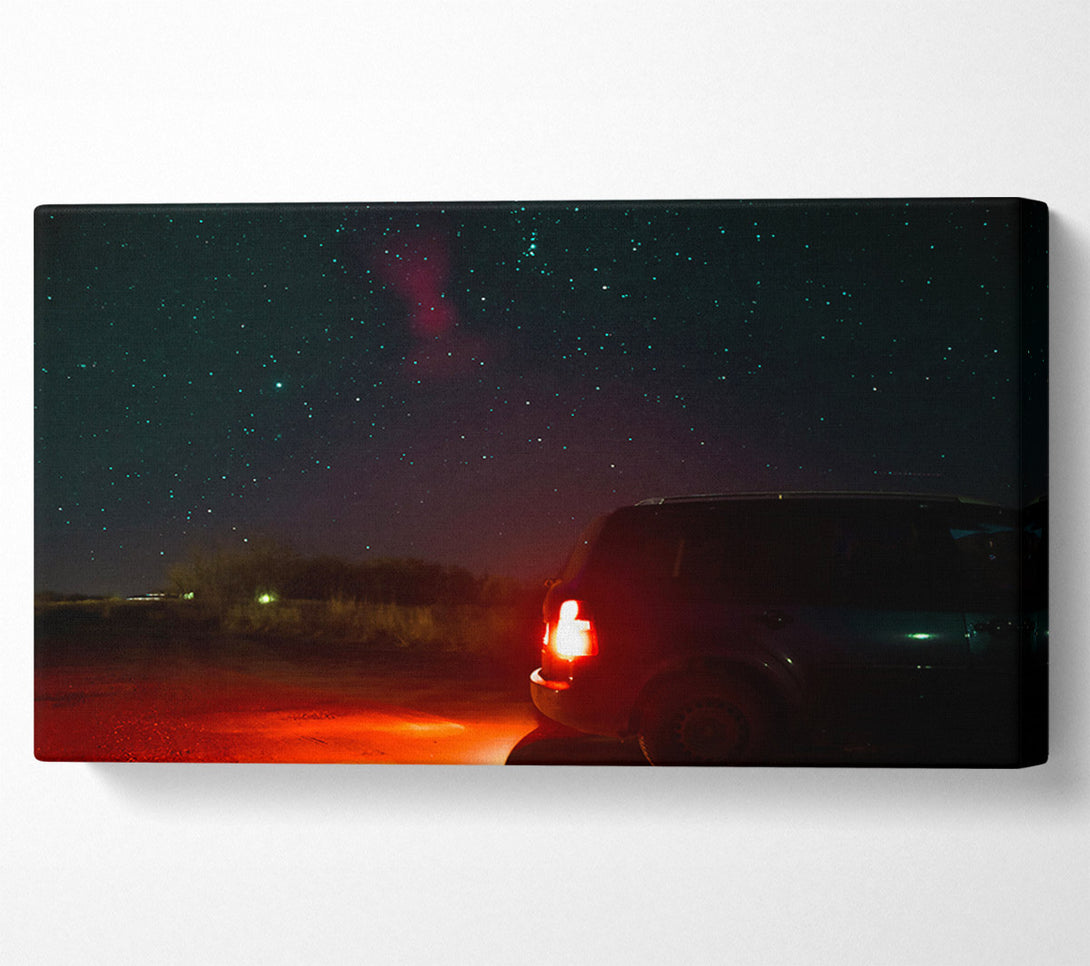  A Canvas Print of Red Taillights Under Stars Canvas Print