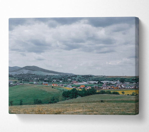  A Canvas Print of Green Hills Under Grey Skies Canvas Print