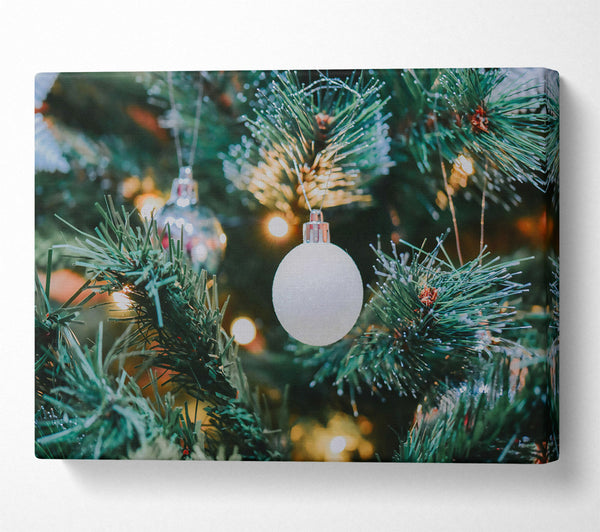  A Canvas Print of White Ornament On Green Tree Canvas Wall Art