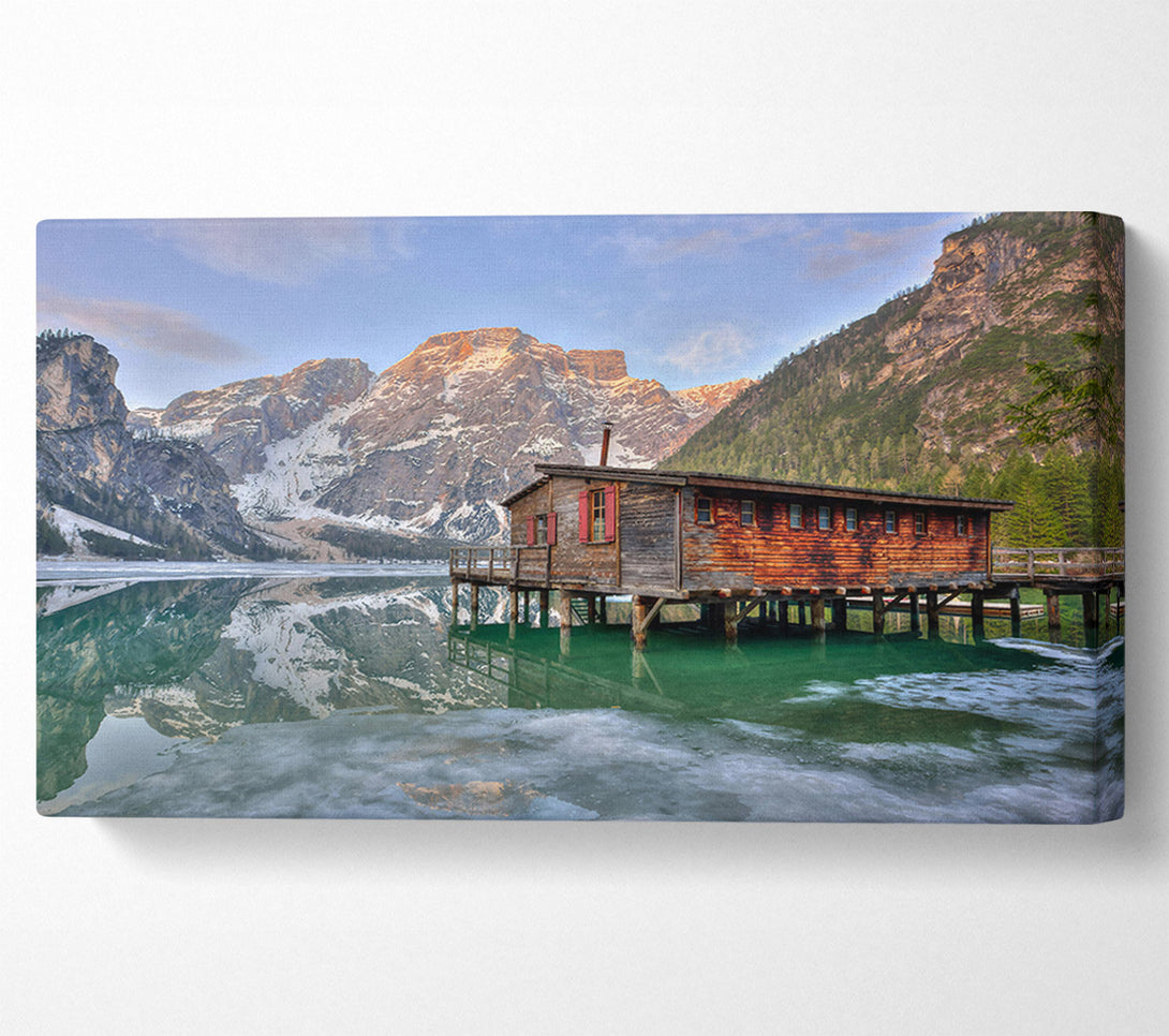  A Canvas Print of Green Cabin Reflects Mountains Canvas Print
