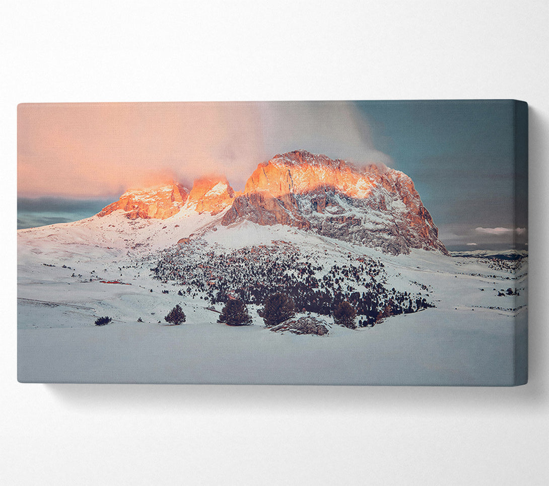  A Canvas Print of Orange Glow On Snow Peaks Canvas Print