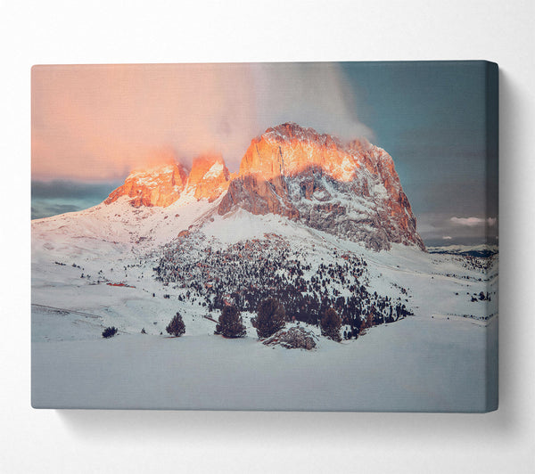  A Canvas Print of Orange Glow On Snow Peaks Canvas Print