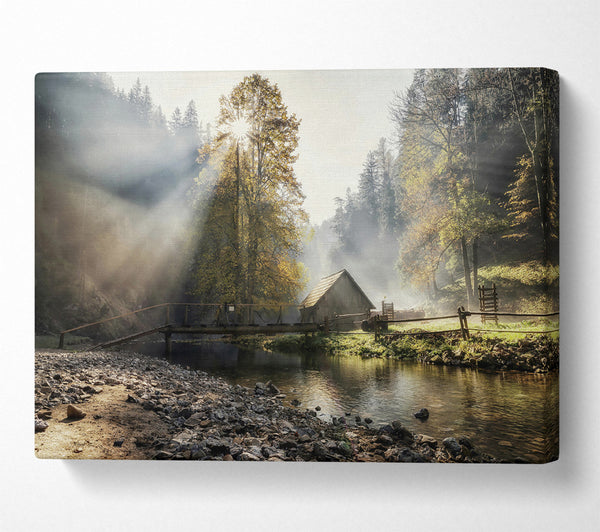  A Canvas Print of Golden Sunbeams Through Mist Canvas Print