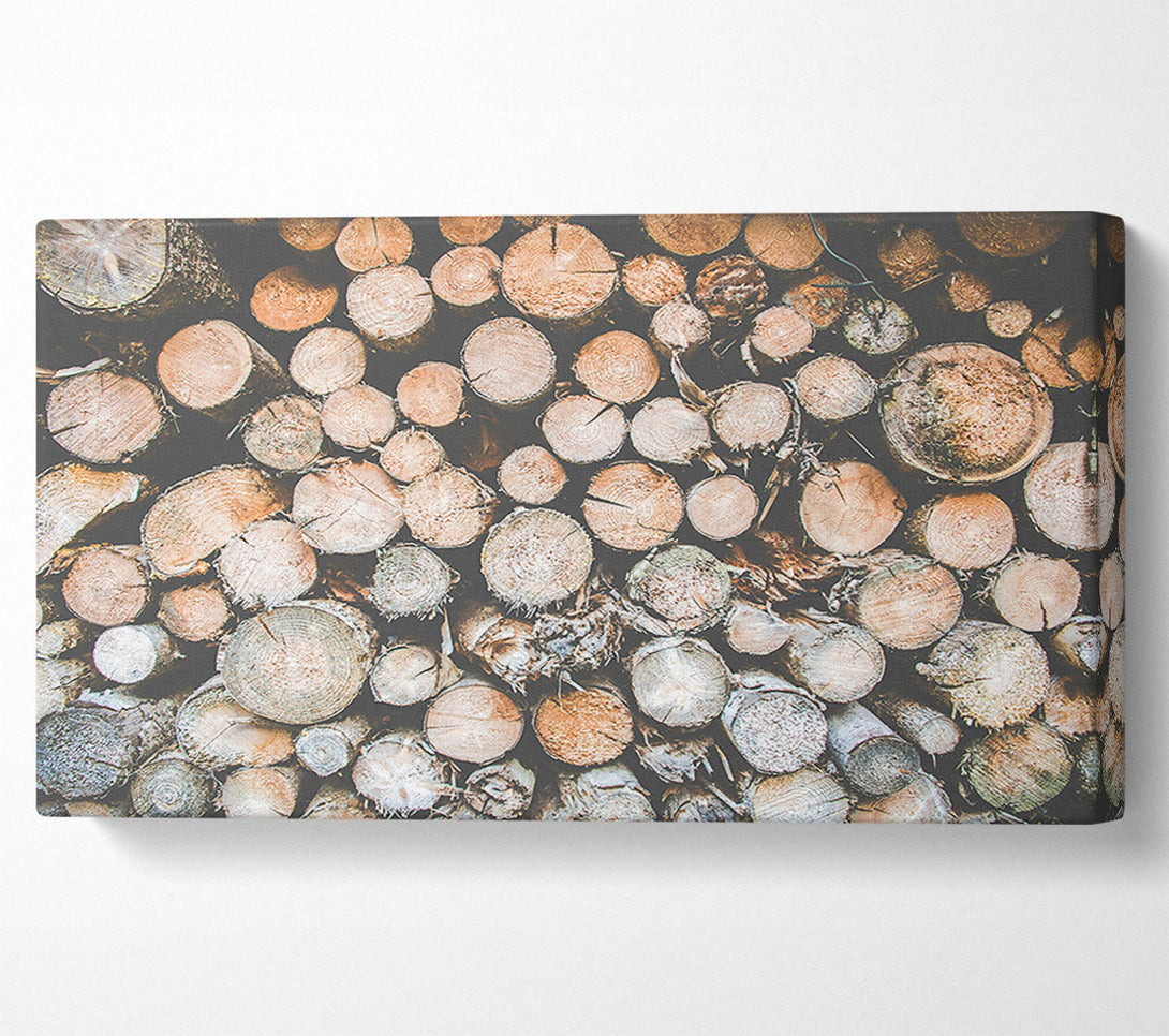  A Canvas Print of Stacked Brown Logs Canvas Art