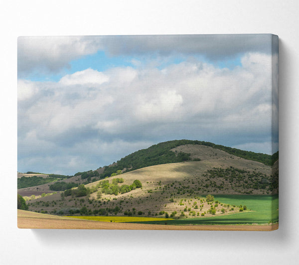  A Canvas Print of Green Hills Under Clouds Canvas Print