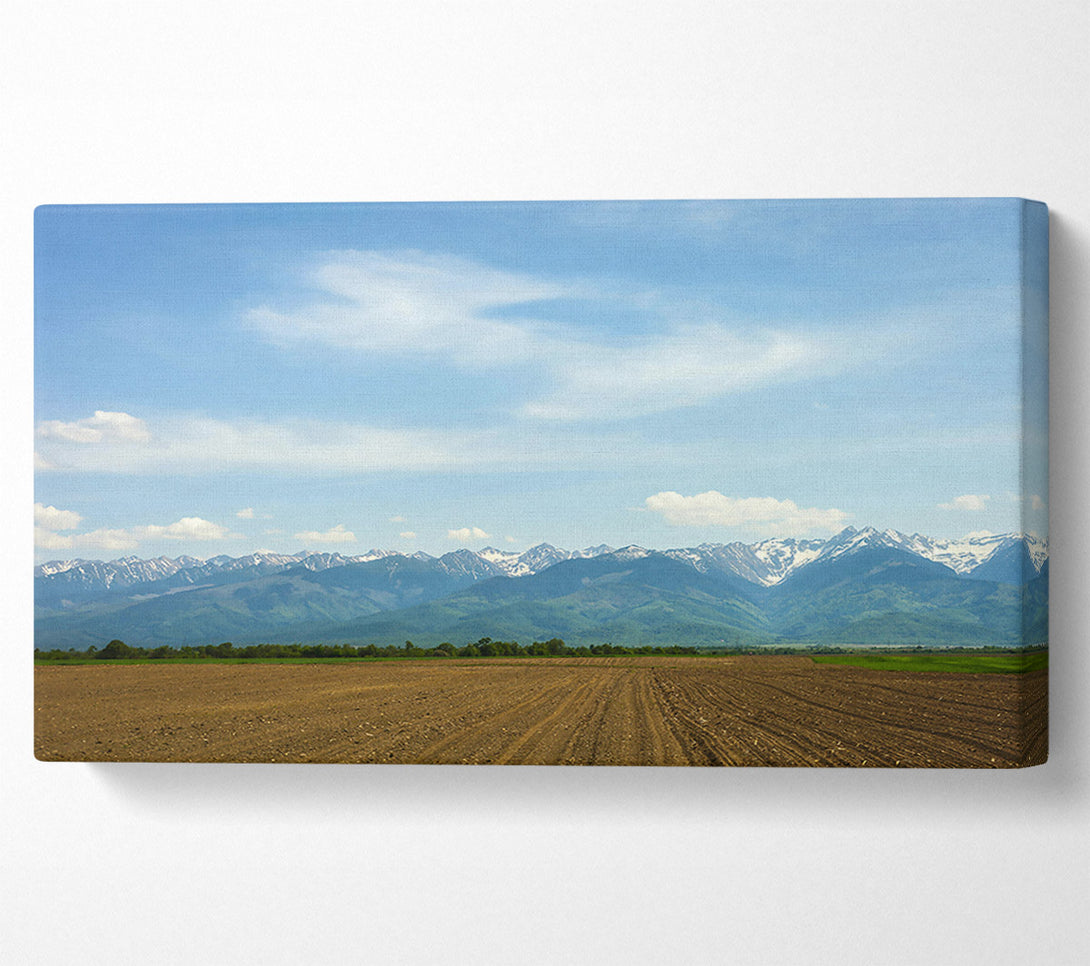  A Canvas Print of Brown Fields And Distant Peaks Canvas Wall Art