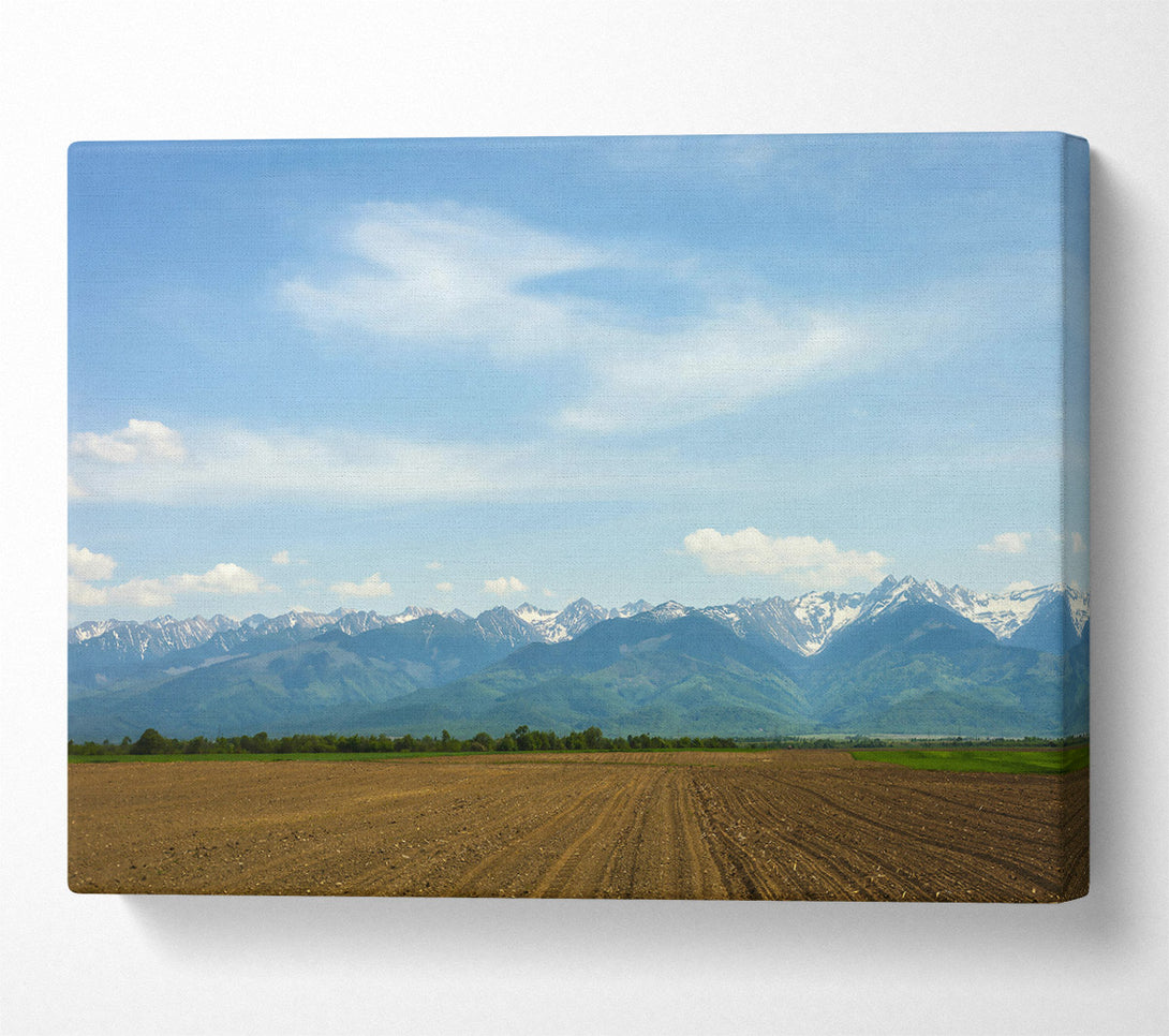  A Canvas Print of Brown Fields And Distant Peaks Canvas Wall Art