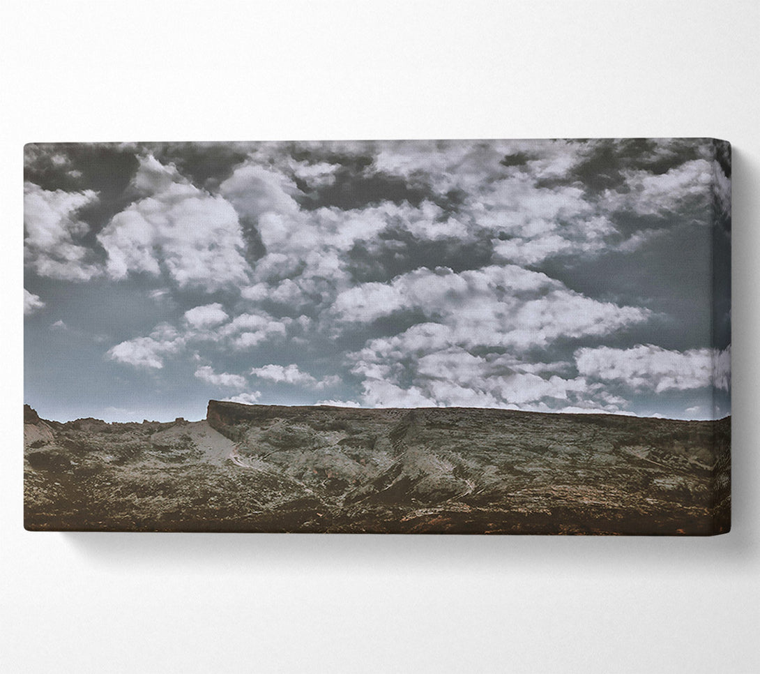  A Canvas Print of Grey Skies Over Rock Canvas Print