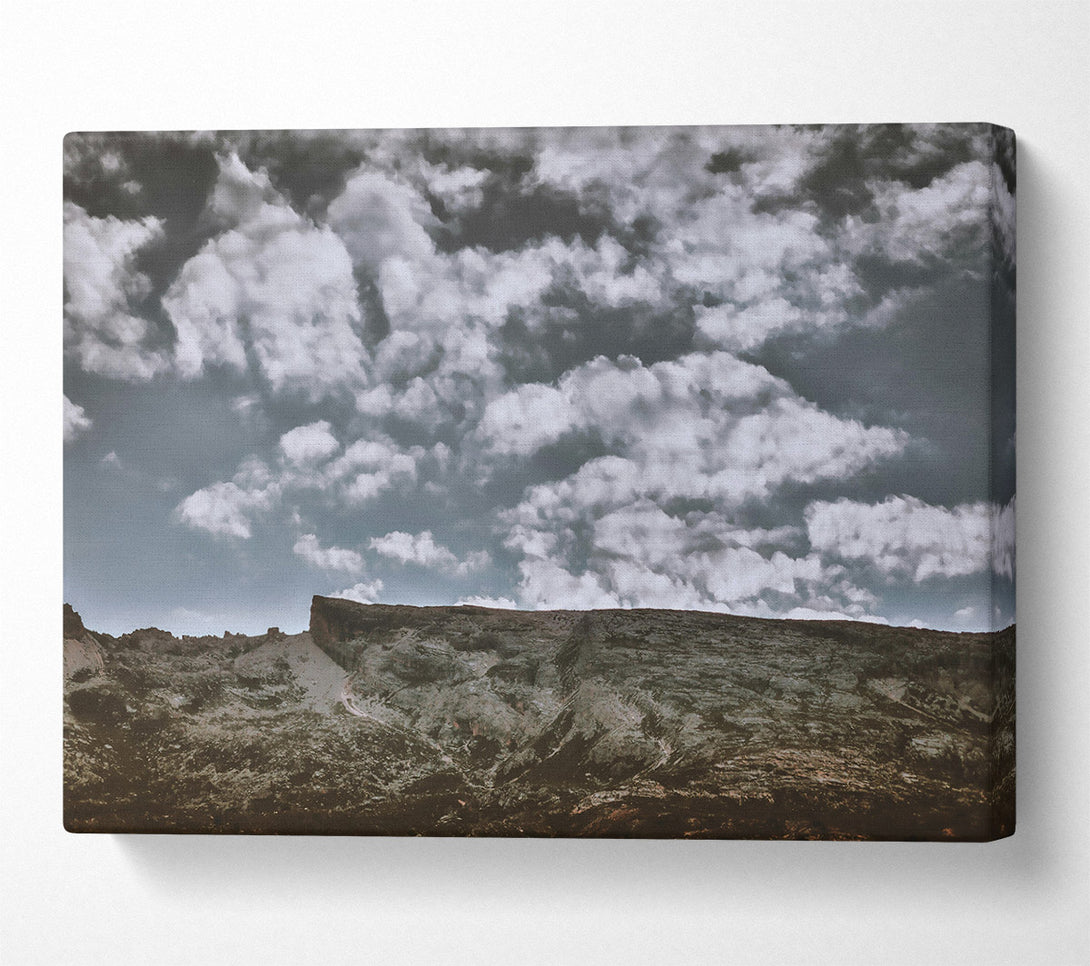  A Canvas Print of Grey Skies Over Rock Canvas Print