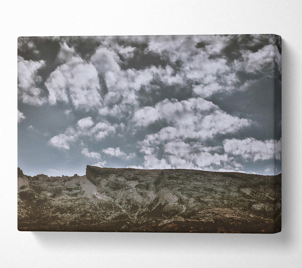 A Canvas Print of Grey Skies Over Rock Canvas Print