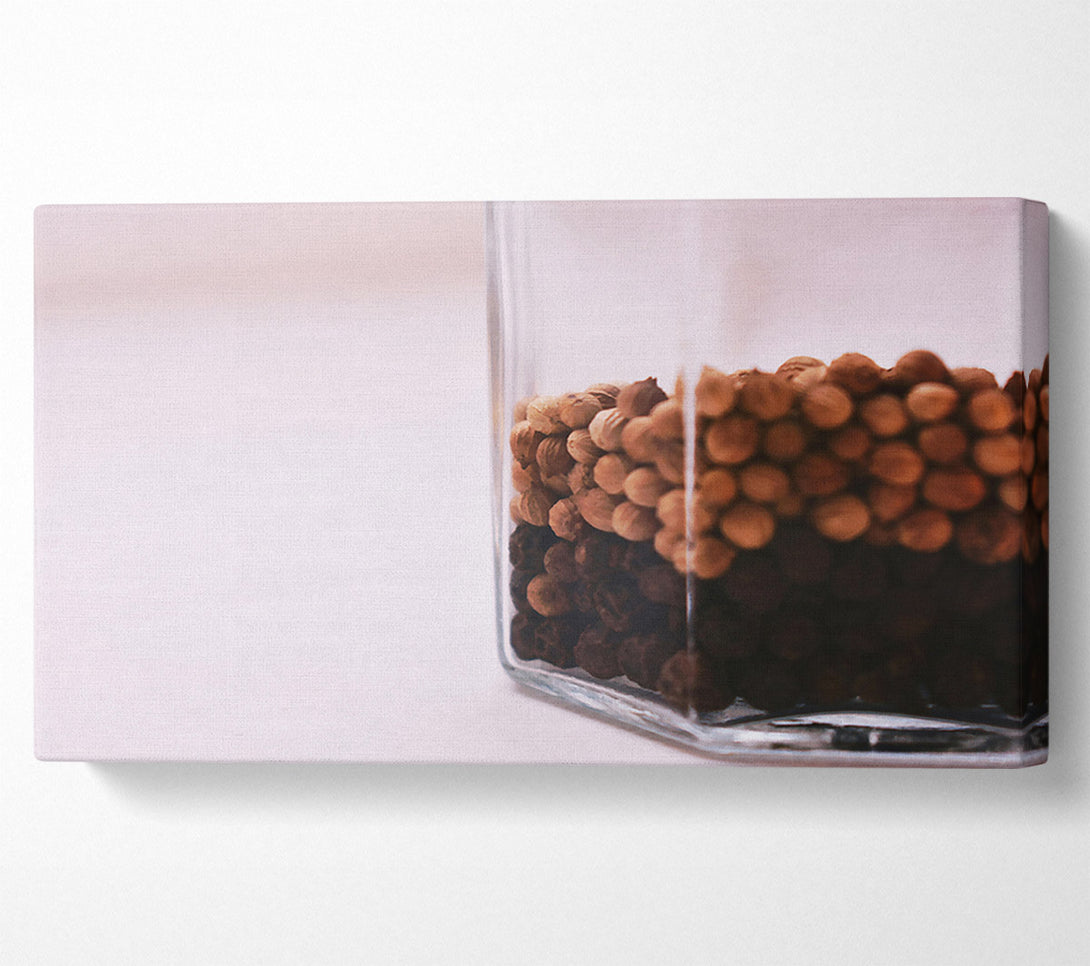  A Canvas Print of Brown Peppercorns In Glass Canvas Art