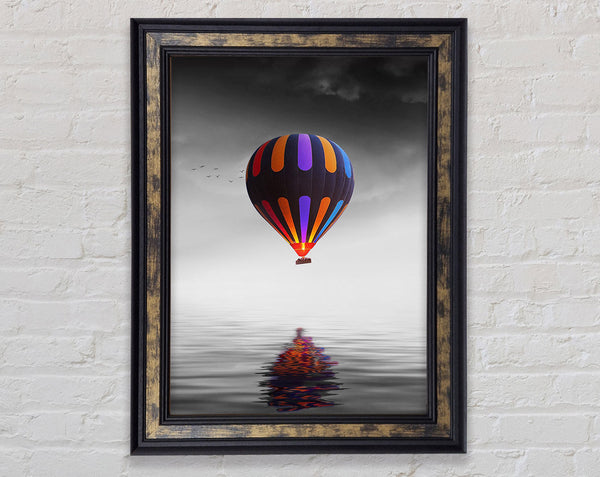 Hot Air Balloon Over A Grey Sea Framed Print