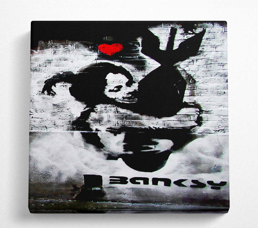 A Square Canvas Print Showing Hugging The Bomb Square Wall Art