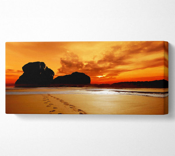 Footprints In The Orange Ocean Sand