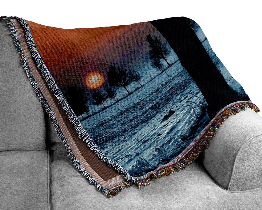 Winter Landscape With Orange Sky Woven Blanket