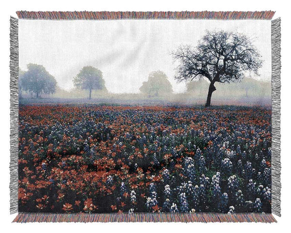 Field Of Flowers In The Morning Mist Woven Blanket