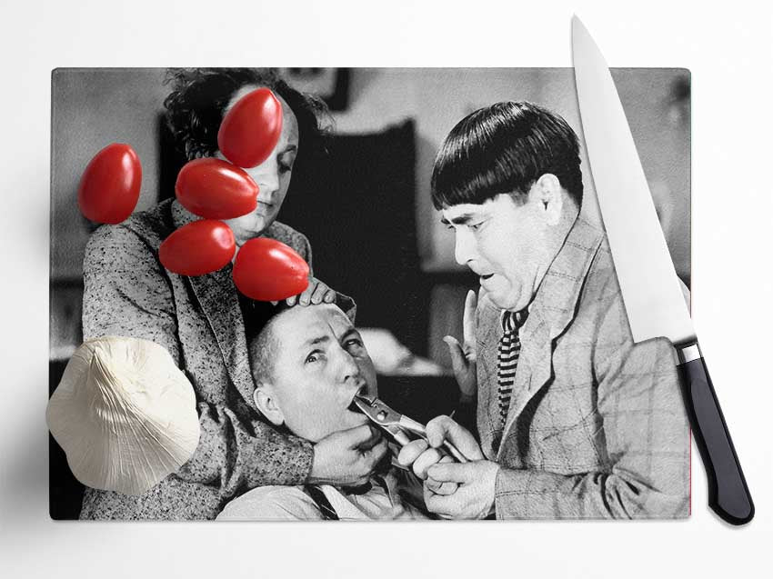The Three Stooges Tooth Pull Glass Chopping Board