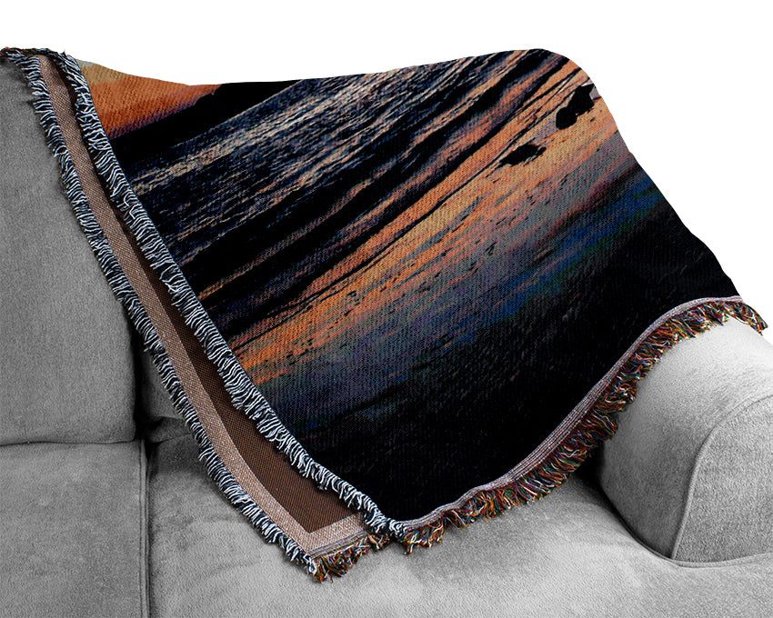 Sunset Behind The Ocean Rocks Woven Blanket