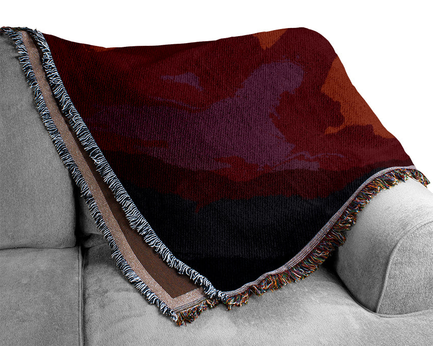 The Glow Of The Red Sun Woven Blanket