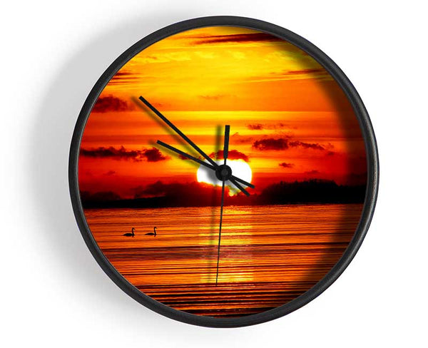 Swans On The Orange Ocean Reflection Clock - Wallart-Direct UK
