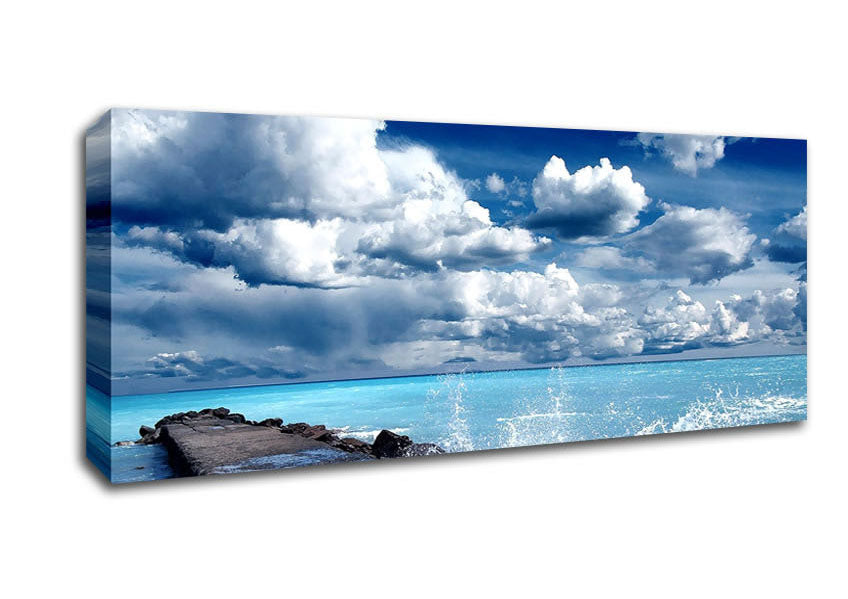 Picture of Gentle Waves Crashing In The Cloud Filled Sky Panoramic Canvas Wall Art