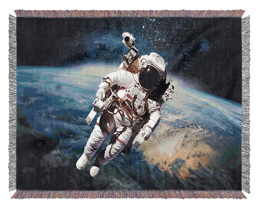 Astronaut Above The Earth Woven Blanket
