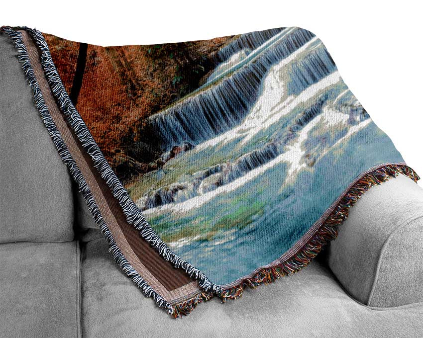 Waterfall forest sunset Woven Blanket