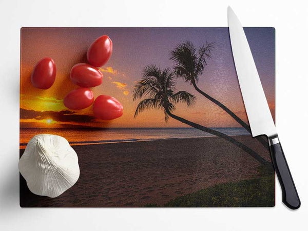 Two palm trees on the beach Glass Chopping Board