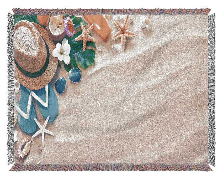 Sunglasses and hat on the beach Woven Blanket