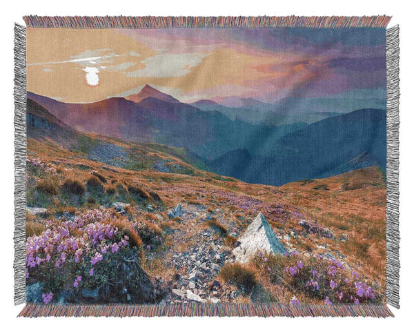 Beautiful mountain range and flowers Woven Blanket
