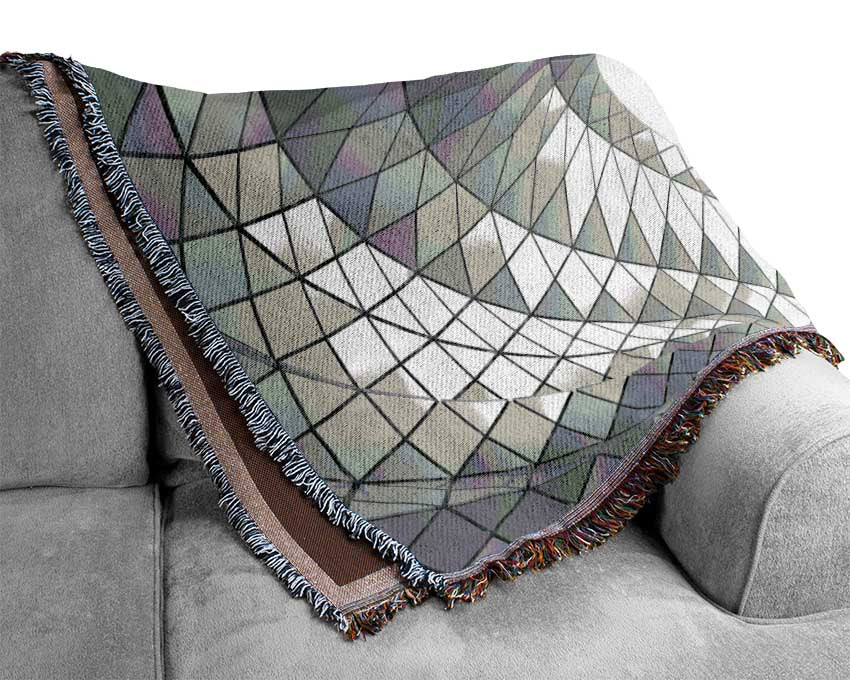 Swirl of geometric shapes on building Woven Blanket