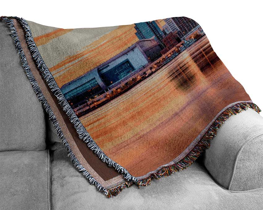 Orange sunset in the city shoreline Woven Blanket