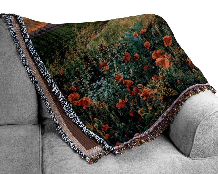 Red poppies in the green countryside Woven Blanket
