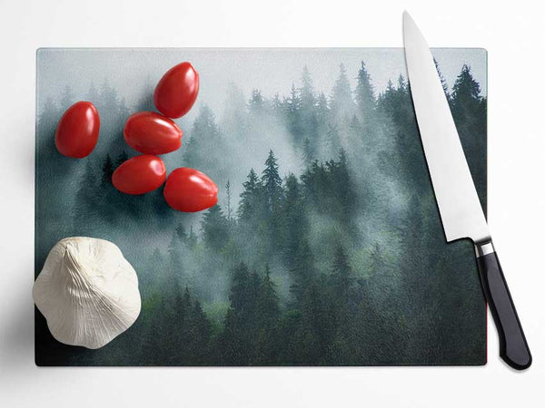 Mist in the dense woods Glass Chopping Board