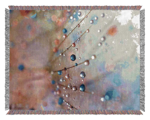 Droplets of colour on a flower Woven Blanket