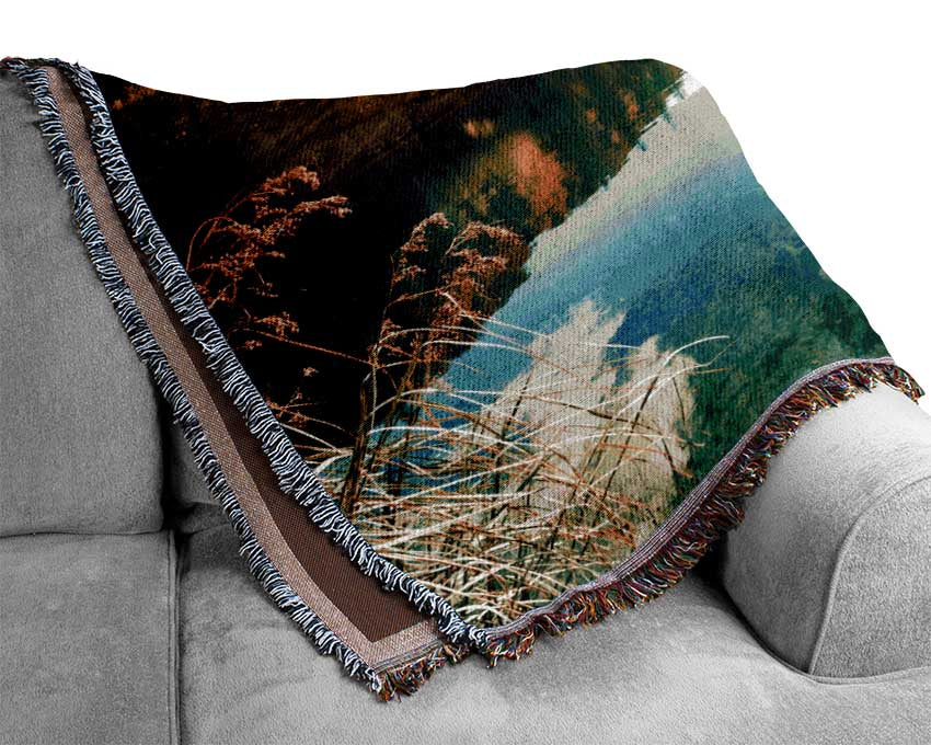 Sun shining on the calm river Woven Blanket