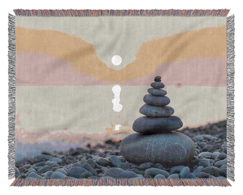 Zen Stones at sunset on the beach Woven Blanket