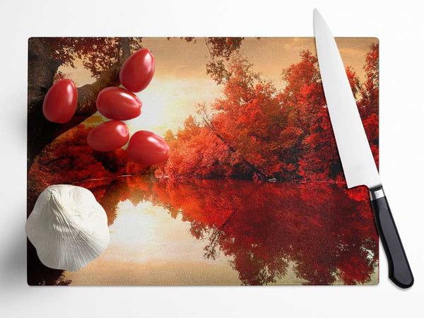 Stunning red forest reflections in the river Glass Chopping Board