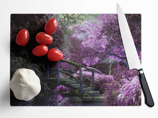Little foot bridge in the lilac forest Glass Chopping Board
