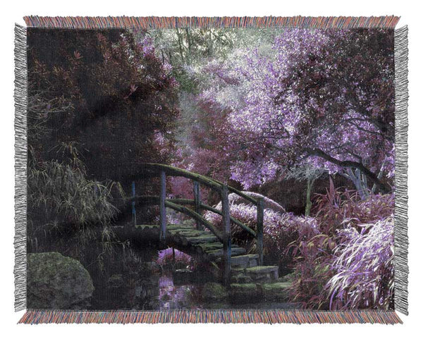 Little foot bridge in the lilac forest Woven Blanket