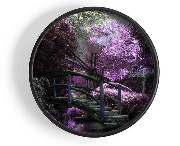 Little foot bridge in the lilac forest Clock - Wallart-Direct UK