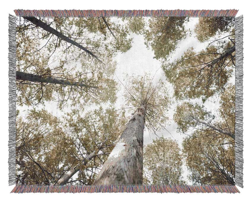 Up the tree to the skies Woven Blanket