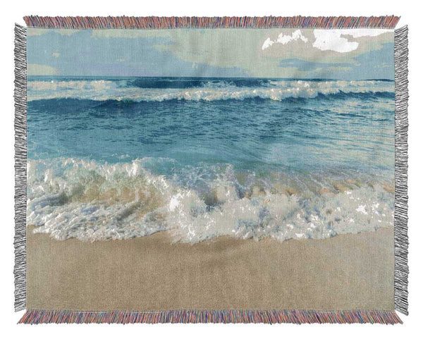 Crashing waves on the sandy beach Woven Blanket