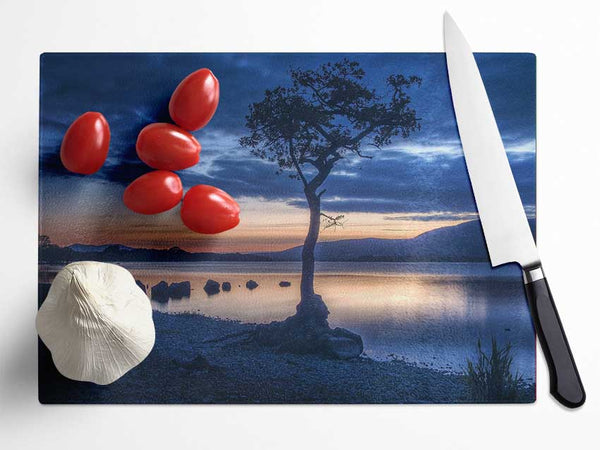 Night time blues by the river Glass Chopping Board