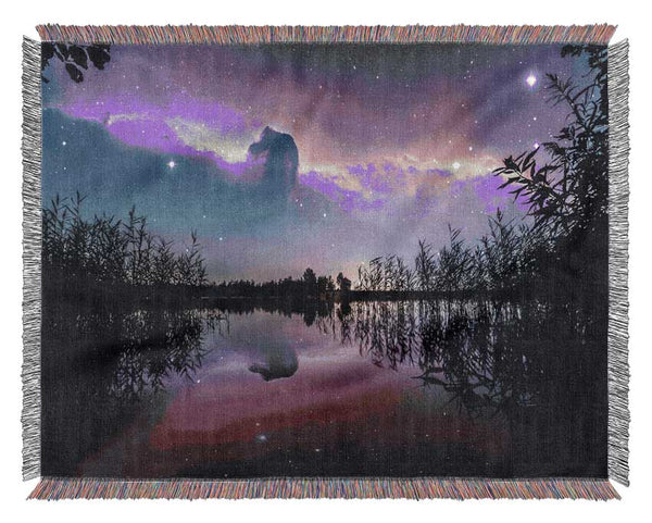 Horse head nebula over a purple lake Woven Blanket