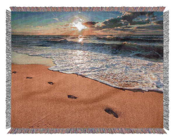 Footprints on the beach Woven Blanket