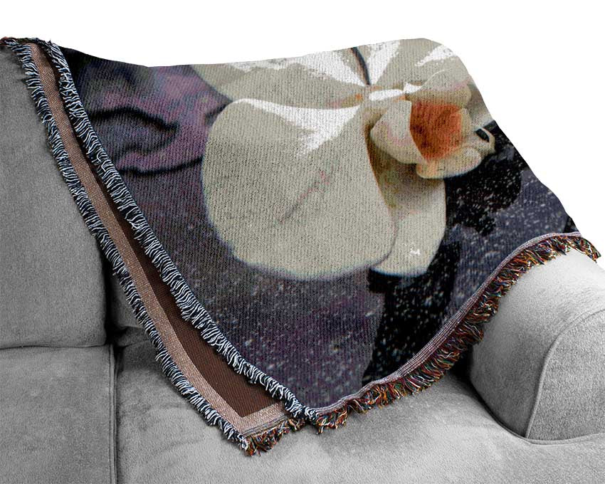 Orchid heads in water Woven Blanket