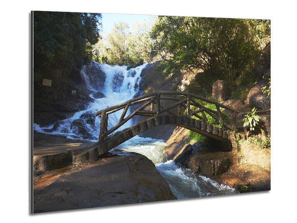 Rustic made bridge by a waterfall Metal Print